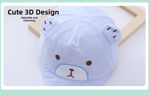 Detail of baby bear hat with 3D ears and blue embroidered cotton face for infants