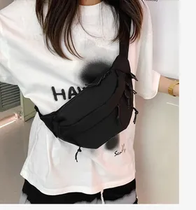 Detail of black tactical fanny pack featuring high-density nylon fabric and zipper cords