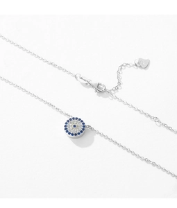 Macro view of S925 sterling silver evil eye pendant with blue and white zircon stones