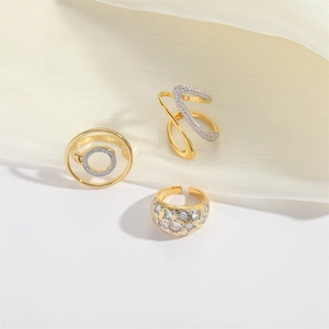 Three gold luxury open rings with geometric zircon paving and vintage embossed texture