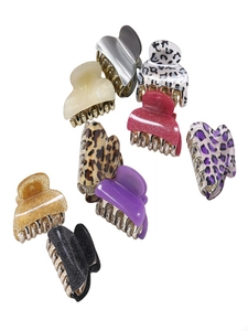 Various small leopard print and solid color hair claw clips with metal springs