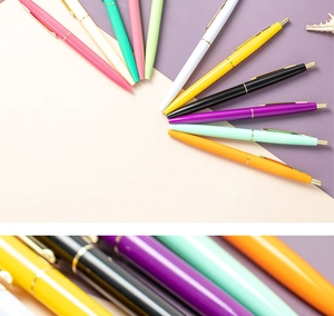 Detail view of multi-color retractable ballpoint pens with smooth glossy finish