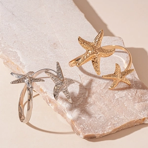 Irregular starfish cuff bracelets in gold and silver finish with textured surface