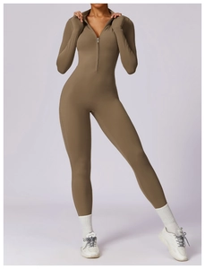 Detail of high-stretch dark brown unitard with front half-zipper and seamless athletic cut