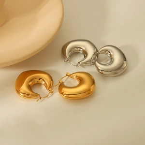 Minimalist gold and silver hollow C-shaped metal earrings in a high-polished finish