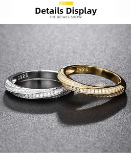 Detailed view of silver and gold Moebius rings featuring S925 hallmark and pave set stones