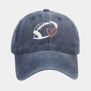 Close-up of navy blue washed cotton baseball cap with rugby and heart embroidery detail