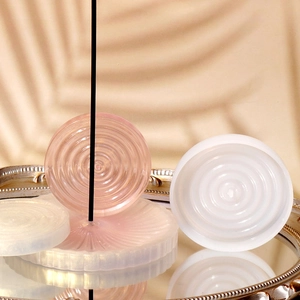 Detailed view of concentric ripple silicone mold with pink resin incense holder