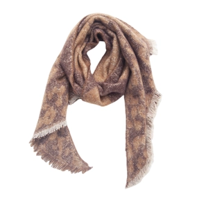 Macro detail of soft brown leopard print scarf featuring thick fringe tassels on the edges