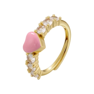Close-up of gold adjustable heart ring with pink enamel and micro-set cubic zirconia