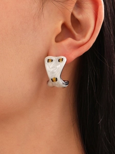 Detailed macro view of white pearl enamel ocean series stud earring on a model