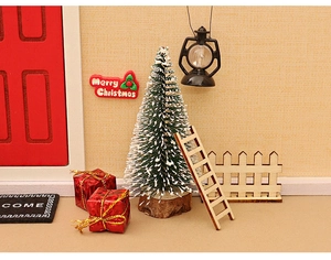 Detailed macro view of dollhouse Christmas miniature set with tree and red door