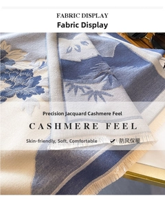 Detail of floral jacquard cashmere feel scarf with soft fringes and blue floral pattern