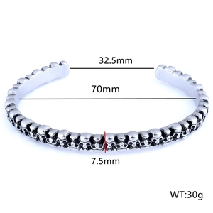 Detail view of punk style skull bangle with 70mm inner diameter and 7.5mm width