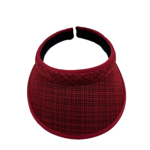 Close-up of deep red plaid woven sun visor with moisture-wicking black inner lining