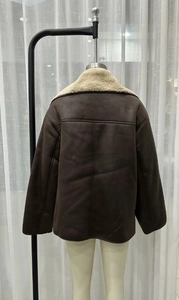 Rear view of brown faux leather shearling jacket with cream faux fur collar and trim
