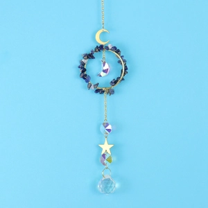 Detail of moon and star suncatcher with blue stones and clear crystal prisms