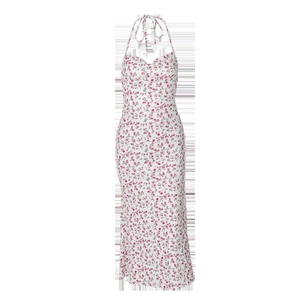 Detail of floral halter dress with pink flowers and tie neck on white fabric