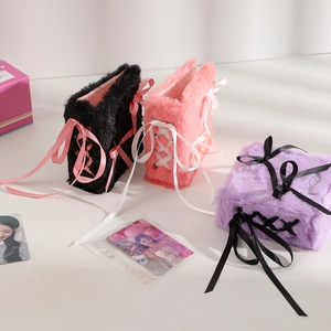 Three plush ballet-style card albums in black, pink, and purple with decorative ribbons