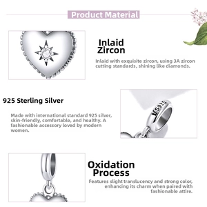 Detailed macro view of S925 sterling silver heart charm with 3A zircon starburst engraving