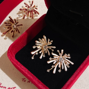 Sparkling firework stud earrings in gold finish with red and white rhinestones