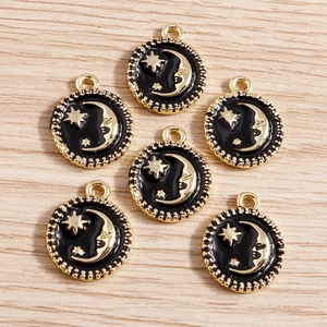 Set of 6 black enamel star and moon alloy pendants with gold beaded borders