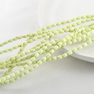 Macro shot of oval turquoise beads with smooth texture for DIY jewelry making and necklaces