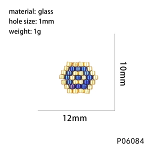 Detail of 12mm evil eye hexagon charm made of blue and gold woven glass beads