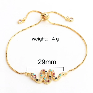 Detail of adjustable gold snake bracelet with colorful cubic zirconia and sliding clasp