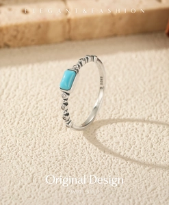 Macro shot of S925 silver ring featuring a turquoise stone and delicate side zircon pavé
