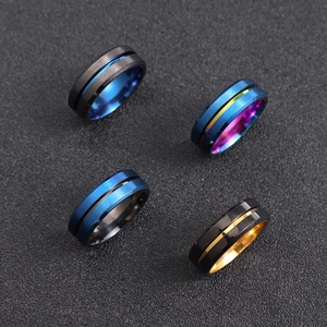 Set of four brushed matte stainless steel spinner rings with two-tone color finishes
