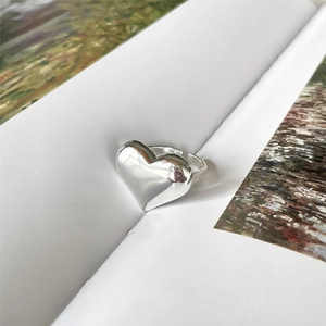 Polished silver heart ring on book, adjustable minimalist 925 sterling silver design