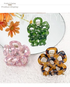 French hollow flower acetate hair claws with rhinestones in green, pink, and amber colors