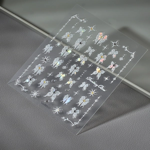 Fantasy Bow nail stickers featuring white bows, butterflies and aurora crystals decoration