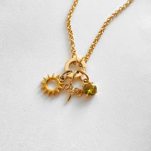 14K gold plated stainless steel necklace with sun and zodiac Aries pendant.