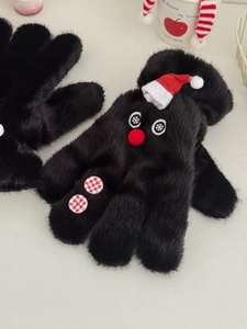 Detail of black faux fur snowman gloves with red hats and decorative plaid buttons