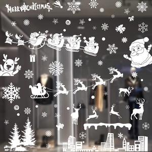 White Christmas window decals with snowflakes reindeer and Santa city silhouette