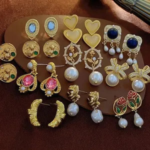 Vintage Baroque pearl and heart earrings collection with gold finish and gemstones