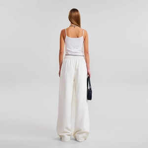 White high-waisted wide-leg sweatpants and camisole set with elastic waist and relaxed fit