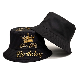 Black cotton bucket hat with golden crown and It's My Birthday print from two angles