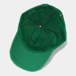 Deep green washed cotton baseball cap with distressed brim and adjustable metal buckle