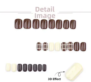 Detail view of mocha brown and cream press-on nails with 3D sweater texture and plaid patterns