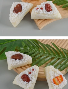 Detailed view of PVC glutinous rice zongzi models with realistic red dates and beans texture