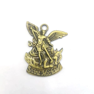Detail of Saint Michael Archangel relief pendant in brass showing the dragon scene