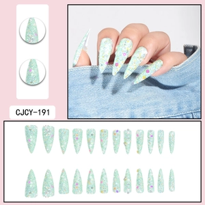 Long stiletto press-on nails in mint green with colorful sequins and fine glitter finish