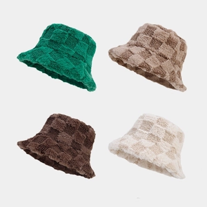 Detail view of plush checkered bucket hats in green, khaki, coffee, and beige colors