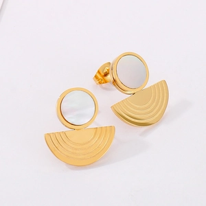 Detail of gold geometric earrings with mother of pearl inlay and radial brushed metal finish