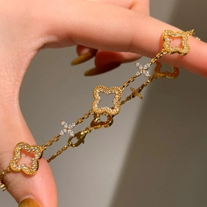 Elegant 24K gold plated clover bracelet with sparkling white zircon and hollow floral charms
