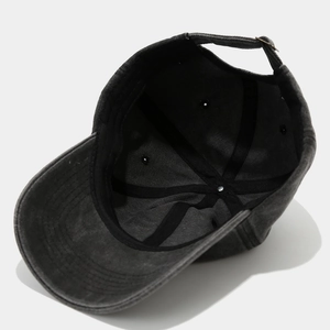 Detail of baseball cap interior showing black sweatband and reinforced stitching