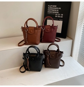 Detailed view of four small PU leather bucket bags in brown, burgundy, black, and dark brown